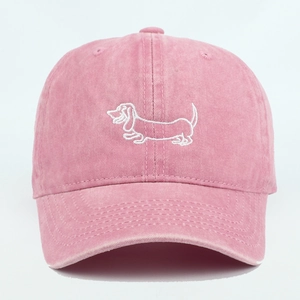 Pink washed cotton baseball cap with white dachshund embroidery in a vintage sporty style