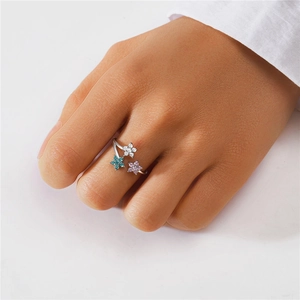Detailed shot of S925 silver ring featuring three colorful floral petals and small diamonds