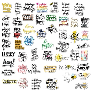 Macro view of assorted motivational waterproof vinyl stickers with positive English quotes