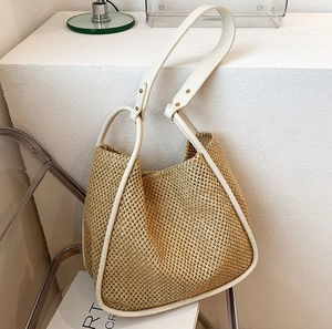Chic summer straw tote bag with beige leather trim and wide straps for women