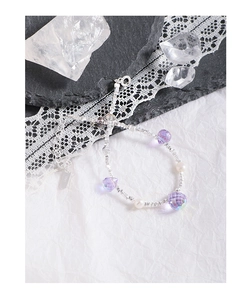 Detail view of S925 sterling silver bracelet featuring purple crystals and white pearls
