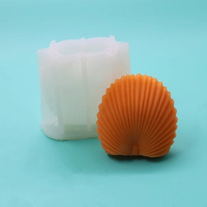 Detail view of scalloped seashell silicone mold with 3D textured orange wax candle finish