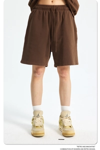 Detail of retro washed brown heavy cotton shorts showing fabric texture and athletic fit