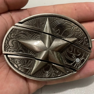Macro shot of vintage silver eagle head belt buckle knife with intricate metal textures
