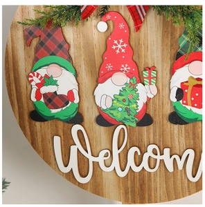 Detailed close-up of wooden Christmas welcome sign with 3D letters and gnome figures