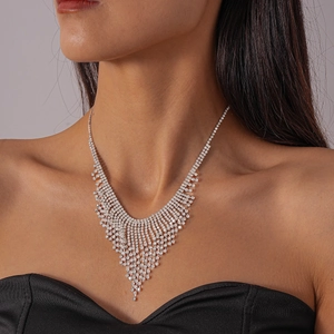 Detailed close-up of luxury water-drop tassel v-shaped necklace with rhinestones
