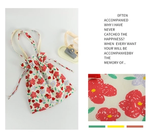 Detail of floral printed canvas tote bag with drawstring closure and soft cotton fabric