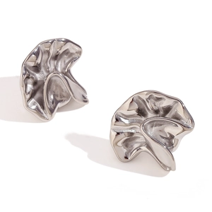 Irregular textured silver drop earrings with a modern minimalist wrinkled metal finish