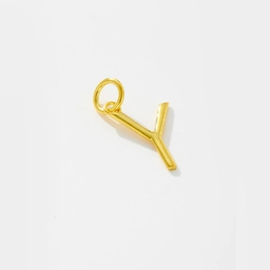 Detail of a polished gold letter Y pendant in S925 sterling silver for women