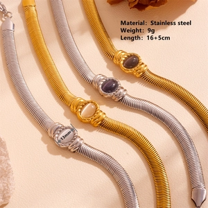 Stainless steel chain bracelet with cat-eye stone pendant in gold and silver finish