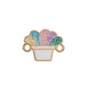 Detailed macro of a gold potted plant pendant with colorful glitter enamel inlay