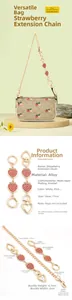 Detail of strawberry charm bag extender chain with gold hearts on a classic small purse
