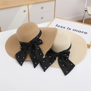 Women's wide brim straw sun hats in khaki and beige with pearl bow ribbons for beach