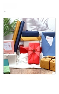 Macro detail of matte gift wrapping paper with ribbons, wax seals and love message cards