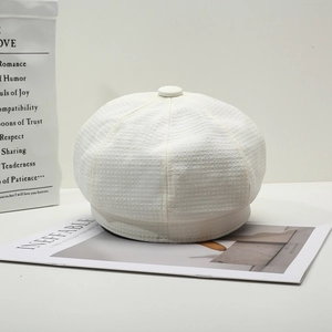 British style cream white newsboy cap for women with textured woven fabric finish