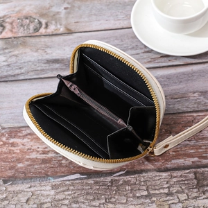 Interior view of white small zipper wallet showing card slots and coin pocket