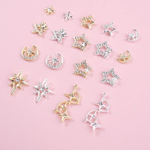 Mix of gold and silver hollow star and moon nail art charms with pearls and rhinestones