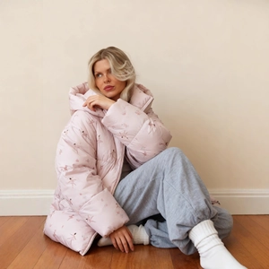 Women's light pink hooded puffer jacket with delicate ballerina print in a relaxed fit