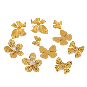 Set of 8 gold stainless steel earrings with butterfly, flower and pearl designs