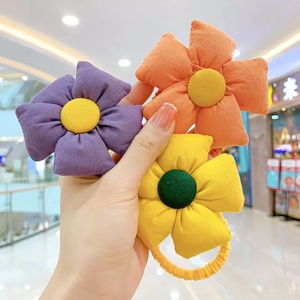 Three-piece floral hair ties set for girls in purple orange and yellow fabric