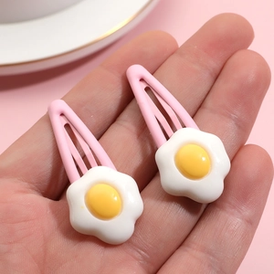 Cute poached egg flower hair clips for women in pink and yellow resin finish