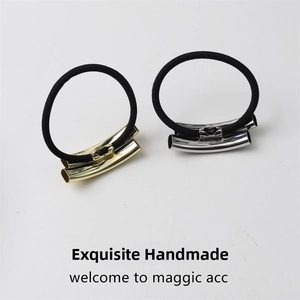 Close-up of high-elasticity hair ties with polished gold and silver metallic curved tubes