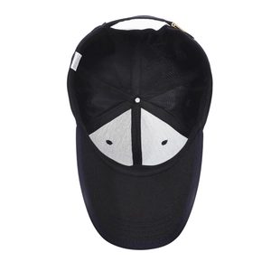 Internal view of black baseball cap showing sweatband and golden metal buckle adjustment