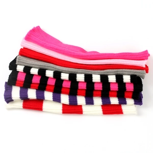 Close-up of ribbed knit texture on striped leg warmers in various color patterns