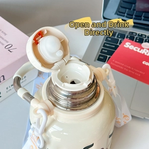 Close-up of insulated water bottle lid with direct drinking spout and portable strap