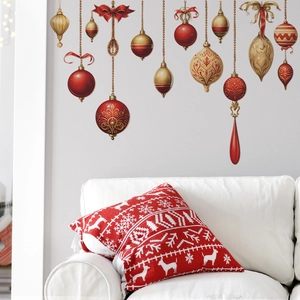 Macro view of Christmas wall stickers featuring festive red and gold ornaments and red pillow