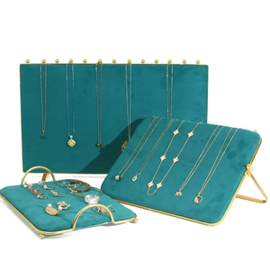 Green velvet jewelry display stand set with gold metal frames for necklaces and rings