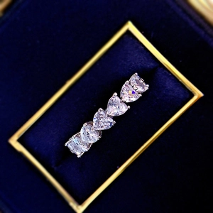 Sparkling S925 sterling silver heart-shaped eternity ring with row of clear crystals