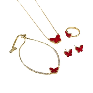 Elegant gold butterfly jewelry set including necklace, bracelet, ring, and earrings with red enamel