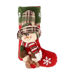 Christmas stocking with snowman 3D plush character and snowflakes on white background