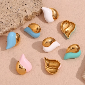 Macro shot of 18K gold plated heart earrings with colorful enamel drip finish