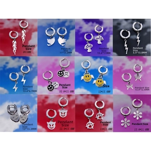 Detailed grid of twelve stainless steel pendant earrings with diverse Y2K street style icons