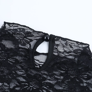 Close-up of black lace high neck with single bead button and hollow teardrop back detail