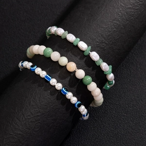 Three-piece bohemian set of pearl, green natural stone and evil eye bead bracelets