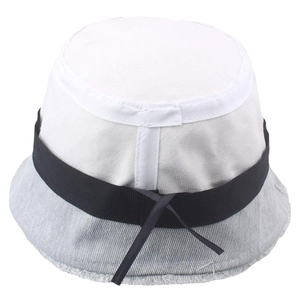 Detail of denim bucket hat with frayed edges and decorative black ribbon bow