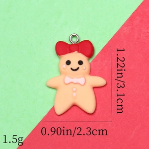 Detailed view of gingerbread man resin charm showing 3.1cm height and 2.3cm width