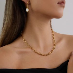 Modern 18K gold plated stainless steel necklace and white gemstone earrings set on model