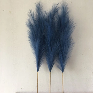 Close-up of three blue artificial pampas grass stems for Nordic home decoration