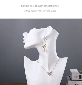 Detail of mannequin bust with bow pendant necklace and long drop earrings set