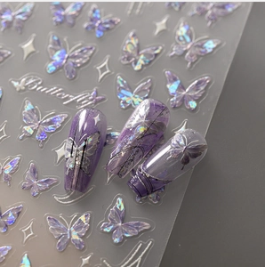 Detailed holographic purple butterfly nail stickers with shimmering laser effect on nails