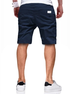 Rear view of navy blue woven beach shorts showing pocket detail and tailored fit