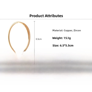 Detailed view of 18k gold plated bangle with zircon inlay, 6.5x5.5cm inner diameter