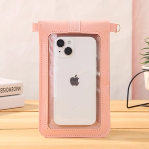 Pink PU leather touchscreen phone bag with crossbody strap on a wooden table