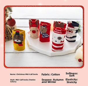 Close-up of cotton Christmas crew socks featuring festive Santa and reindeer patterns