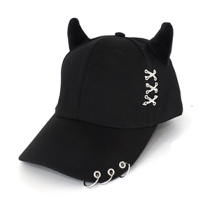 Detail of black punk baseball cap featuring devil horns and silver metal ring accents