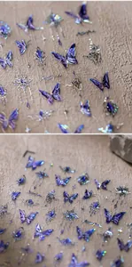 Macro detail of 3D purple butterfly nail art stickers with laser holographic finish